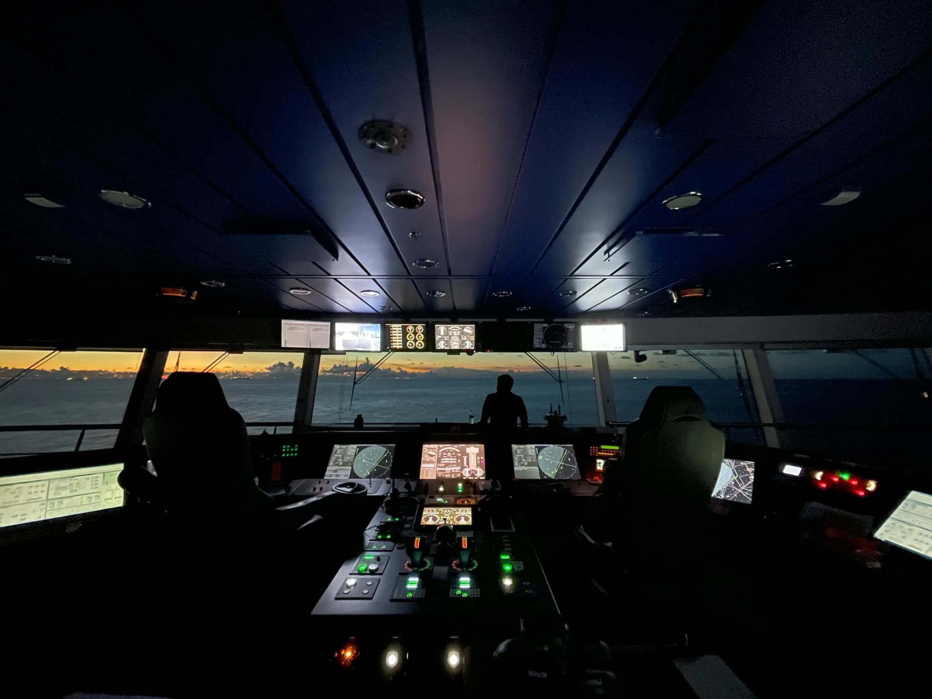 Maritime trainee wearing VR headset practicing engine room procedures in virtual environment